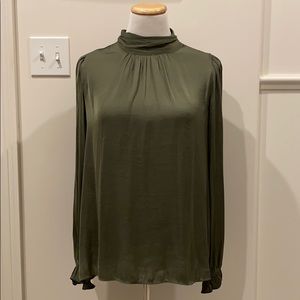 Silky green blouse.